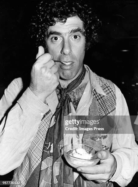 Elliott Gould eating ice cream at the premiere of "Harry and Walter" circa 1976 in New York.