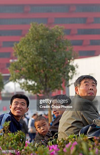 Visitors wait to watch fireworks before the opening ceremony of the 2010 World Expo on April 30, 2010 in Shanghai, China. More than 20 heads of state...