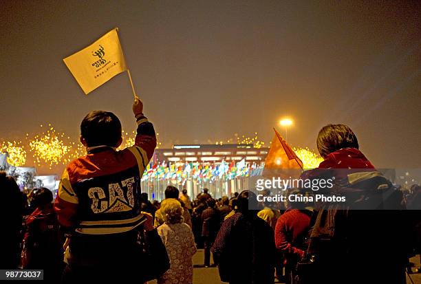Visitors watch fireworks during the opening ceremony of the 2010 World Expo on April 30, 2010 in Shanghai, China. More than 20 heads of state...