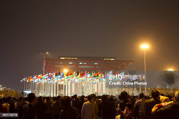Visitors wait to watch fireworks during the opening ceremony of the 2010 World Expo on April 30, 2010 in Shanghai, China. More than 20 heads of state...