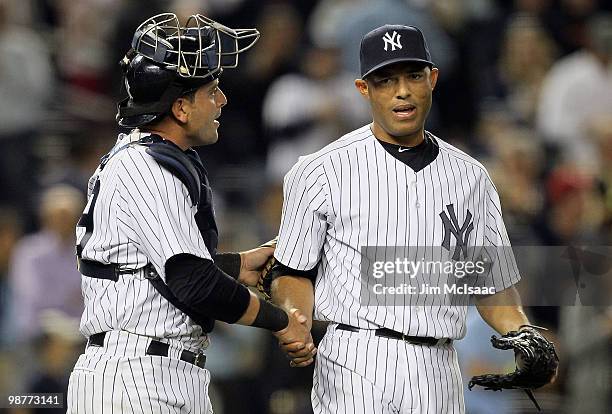 Mariano Rivera and Francisco Cervelli of the New York Yankees celebrate after defeating the Chicago White Sox on April 30, 2010 at Yankee Stadium in...