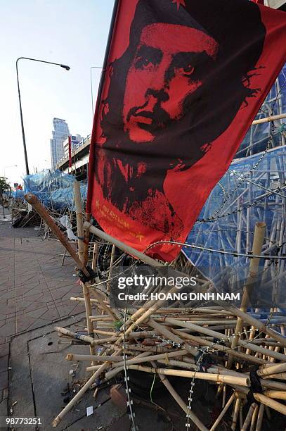 Banner bearing a portrait of Cuban revolutionary Che Guevara is seen on the main barricade of the Red Shirts' fortified camp in the financial central...