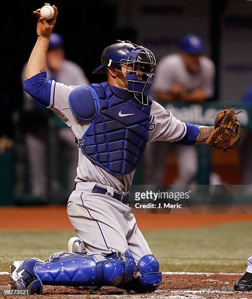 Catcher Jason Kendall of the Kansas City Royals throws the ball back to the pitcher against the Tampa Bay Rays during the game at Tropicana Field on...