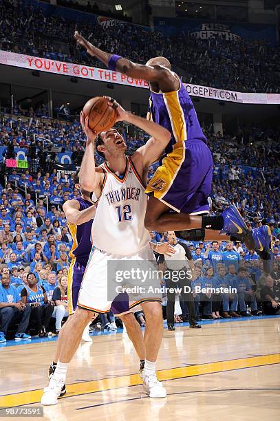 Nenad Krstic of the Oklahoma City Thunder looks to shoot as Kobe Bryant of the Los Angeles Lakers flies over him in Game Six of the Western...