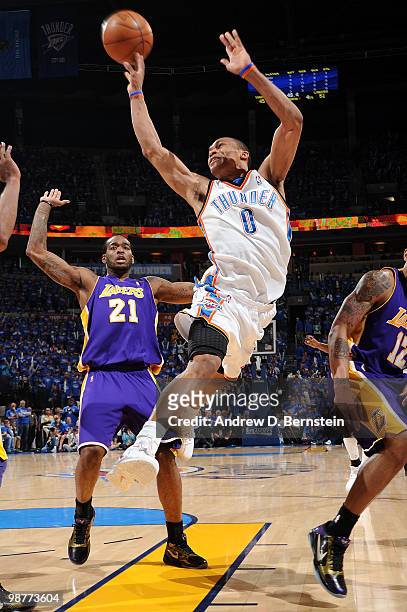 Russell Westbrook of the Oklahoma City Thunder puts up a shot against Josh Powell and the Los Angeles Lakers in Game Six of the Western Conference...