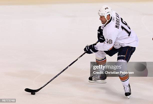 Ethan Moreau of the Edmonton Oilers skates with the puck during the NHL game against the Phoenix Coyotes at Jobing.com Arena on April 3, 2010 in...