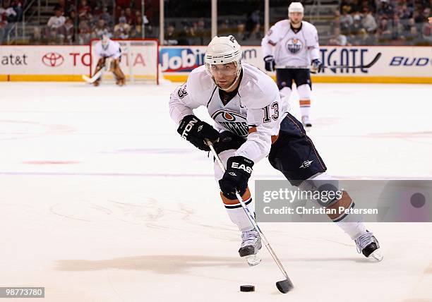 Andrew Cogliano of the Edmonton Oilers skates with the puck during the NHL game against the Phoenix Coyotes at Jobing.com Arena on April 3, 2010 in...