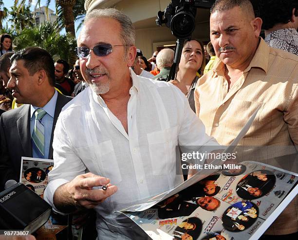 Producer and musician Emilio Estefan Jr. Signs autographs for fans outside the Flamingo Las Vegas during the Las Vegas Walk of Stars unveiling...