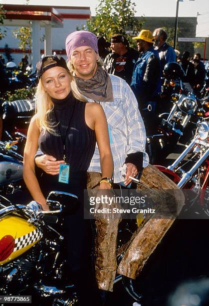 Bret Michaels of Poison and Pamela Anderson pose for a photo at Love Ride 11 to benefit muscular dystrophy on November 13, 1994 in Glendale,...