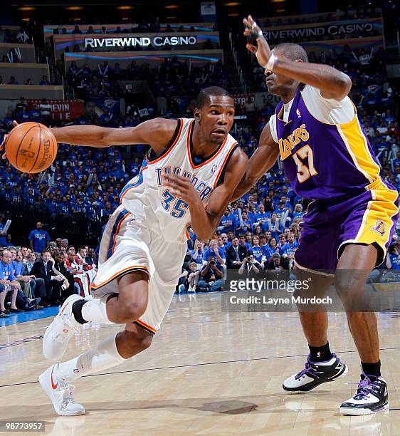 Kevin Durant of the Oklahoma City Thunder drives to the basket against Ron Artest of the Los Angeles Lakers in Game Six of the Western Conference...
