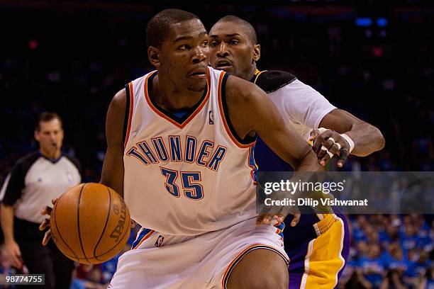 Kevin Durant of the Oklahoma City Thunder drives to the basket against Ron Artest of the Los Angeles Lakers during Game Six of the Western Conference...