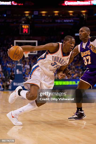 Kevin Durant of the Oklahoma City Thunder drives to the basket against Ron Artest of the Los Angeles Lakers during Game Six of the Western Conference...