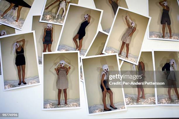 Polaroid images of a models on a table after a fashion show at the South African fashion week on March 26 Turbine Hall in central Johannesburg, South...