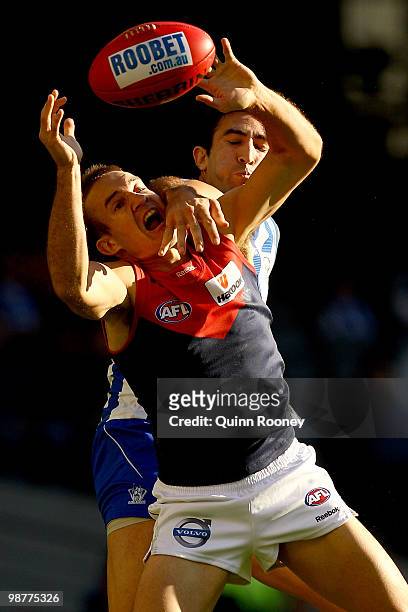 Brad Green of the Demons marks infront of Michael Firrito of the Kangaroos during the round six AFL match between the North Melbourne Kangaroos and...
