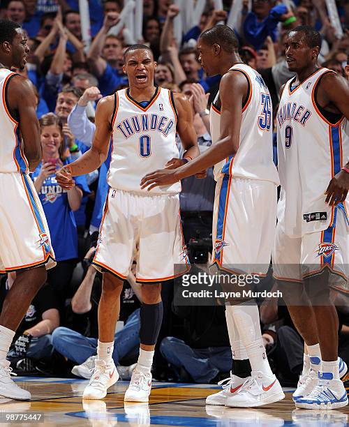 Oklahoma City Thunder players Jeff Green, Russell Westbrook, Kevin Durant, and Serge Ibaka form a huddle during the fourth quarter of Game Six of the...