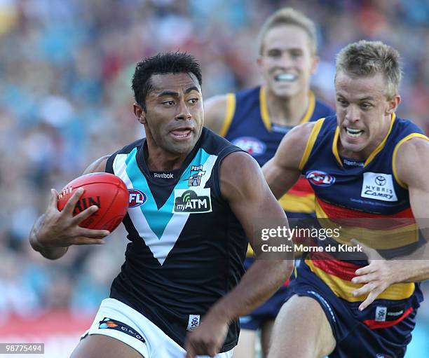 Nathan van Berlo of the Crows chases David Rodan of the Power during the round six AFL match between the Adelaide Crows and the Port Adelaide Power...