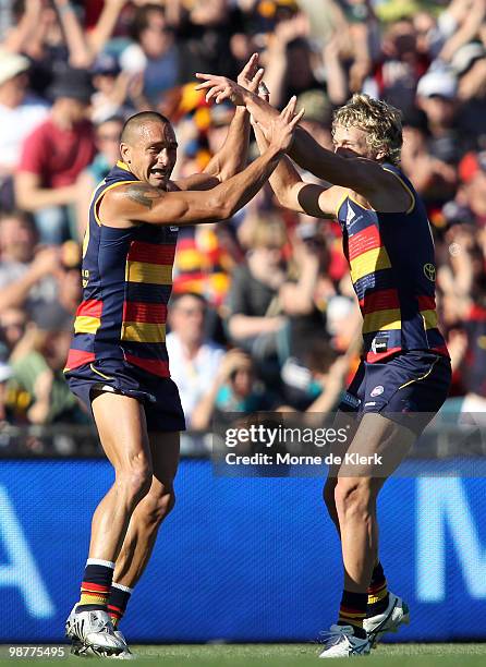 Andrew McLeod and Myke Cook of the Crows Power celebrate a goal during the round six AFL match between the Adelaide Crows and the Port Adelaide Power...