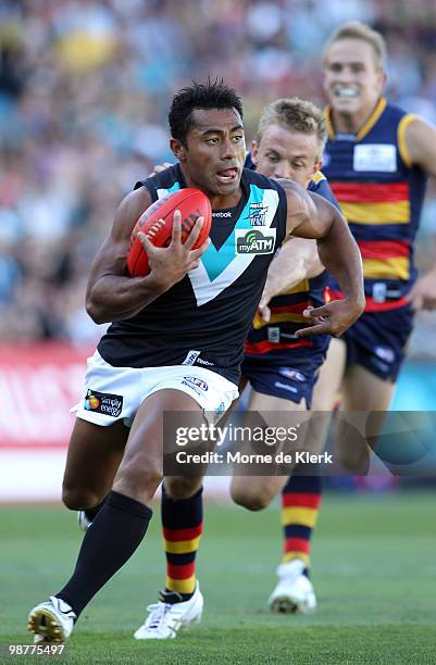 Nathan van Berlo of the Crows chases David Rodan of the Power during the round six AFL match between the Adelaide Crows and the Port Adelaide Power...