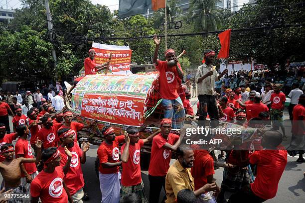 Activists from The Bangladeshi Boatman Labour League take part in a rally with a boat to mark May Day or International Workers� Day in Dhaka on May...
