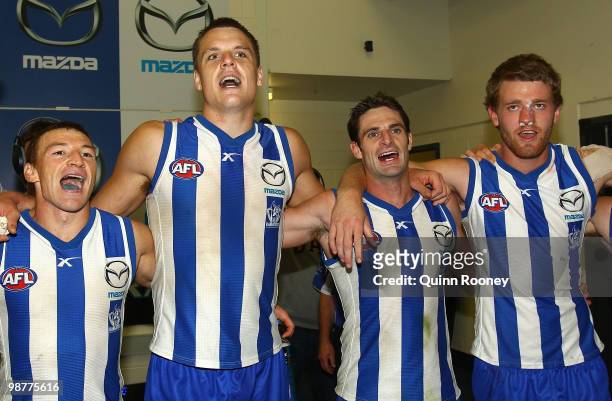 Brent Harvey, Hamish McIntosh, Brady Rawlings and Lachlan Hansen of the Kangaroos sing the song in the rooms after winning the round six AFL match...