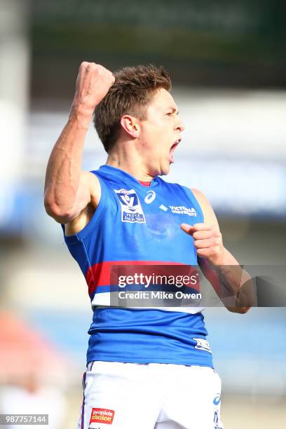 Fergus Greene of Footscray celebrates after kicking a goal during the round 13 VFL match between the Northern Blues and the Footscray Bulldogs at...