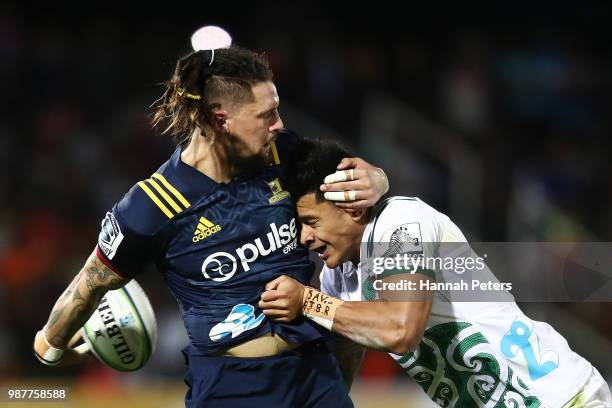 During the round 17: Elliot Dixon of the Highlanders looks to offload the ball during the Super Rugby match between the Highlanders and the Chiefs at...