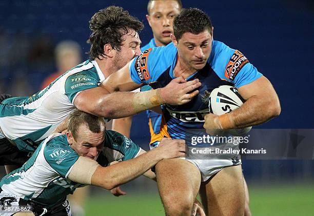 Mark Minichiello of the Titans takes on the Panthers defence during the round eight NRL match between the Gold Coast Titans and the Penrith Panthers...