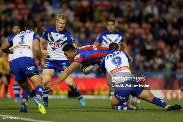 Herman Ese'ese of the Knights scores a try during the round 16 NRL match between the Newcastle Knights and the Canterbury Bulldogs at McDonald Jones...