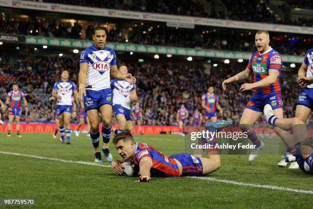 Connor Watson of the Knights scores a try during the round 16 NRL match between the Newcastle Knights and the Canterbury Bulldogs at McDonald Jones...