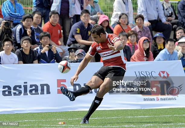 Japan's Ryan Nicholas kicks a goal against South Korea during their match of the Asian Five Nations and Rugby World Cup Asian Qualifiers in...