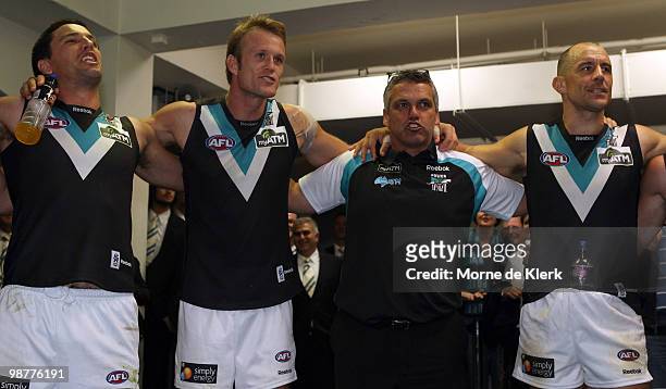 L-r Troy Chaplin, Dean Brogan, Mark Williams and Warren Tredrea of the Power celebrate after winning during the round six AFL match between the...