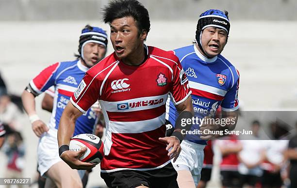 Koji Taira of Japan moves the ball up against South Korea during the Rugby Asia 5 Nations & 2011 Rugby World Cup Qualifier between South Korea and...