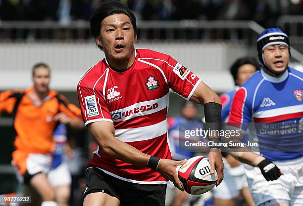 Koji Taira of Japan moves the ball up against South Korea during the Rugby Asia 5 Nations & 2011 Rugby World Cup Qualifier between South Korea and...