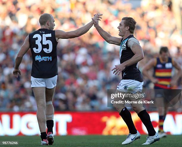 Chad Cornes and Brett Ebert of the Power celebrate a goal during the round six AFL match between the Adelaide Crows and the Port Adelaide Power at...