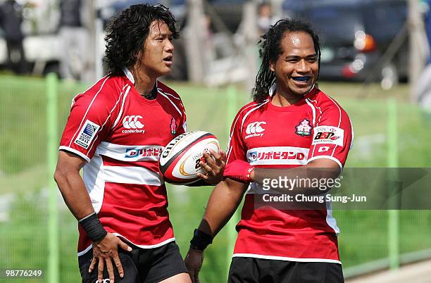 Kosuke Endo of Japan celebrate with Sione Vatuvei after score a try during the Rugby Asia 5 Nations & 2011 Rugby World Cup Qualifier between South...