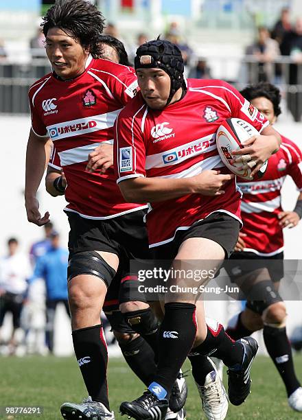 Hisateru Hirashima of Japan moves the ball up against South Korea during the Rugby Asia 5 Nations & 2011 Rugby World Cup Qualifier between South...