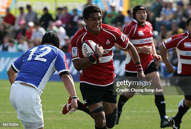 Touetsu Taufa of Japan is tackled during the Rugby Asia 5 Nations & 2011 Rugby World Cup Qualifier between South Korea and Japan on May 1, 2010 in...