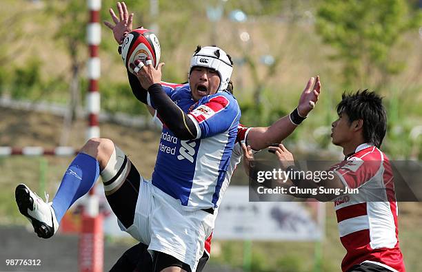 Choi Si-Won of South Korea is tackled during the Rugby Asia 5 Nations & 2011 Rugby World Cup Qualifier between South Korea and Japan on May 1, 2010...