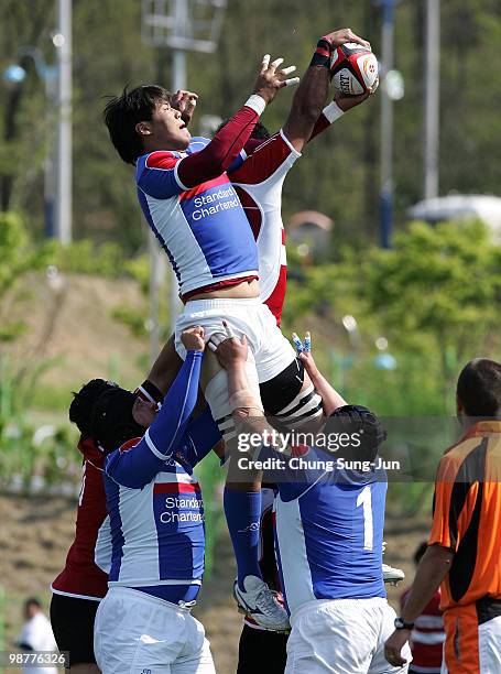 Kim Jong-Su of South Korea duels for a lineout win during the Rugby Asia 5 Nations & 2011 Rugby World Cup Qualifier between South Korea and Japan on...