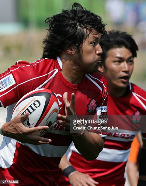 Kosuke Endo of Japan moves the ball up against South Korea during the Rugby Asia 5 Nations & 2011 Rugby World Cup Qualifier between South Korea and...