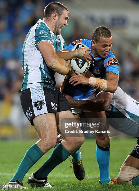 Scott Prince of the Titans is tackled during the round eight NRL match between the Gold Coast Titans and the Penrith Panthers at Skilled Park on May...