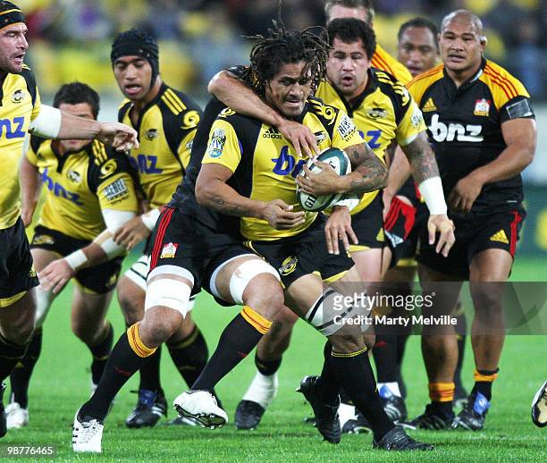 Rodney So'oialo of the Hurricanes is tackled by Liam Messam captain of the Chiefs during the round 12 Super 14 match between the Hurricanes and the...
