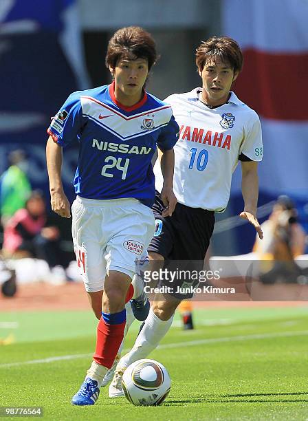 Takashi Kanai of Yokohama F. Marinos and Sho Naruoka of Jubilo Iwata compete for the ball during the J. League match between Yokohama F. Marinos and...