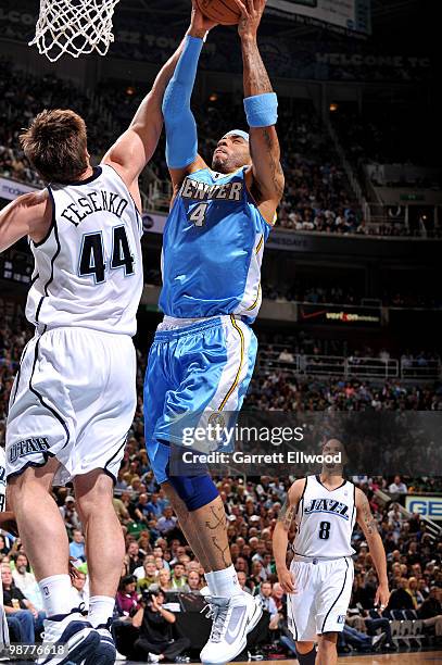 Kenyon Martin of the Denver Nuggets goes to the basket against Kyrylo Fesenko of the Utah Jazz in Game Six of the Western Conference Quarterfinals...