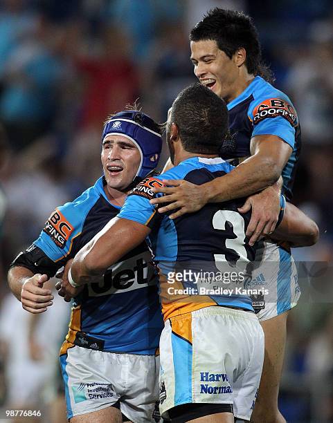 Clinton Toopi of the Titans celebrates with team mates after scoring a try during the round eight NRL match between the Gold Coast Titans and the...