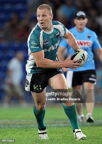 Luke Lewis of the Panthers looks to pass during the round eight NRL match between the Gold Coast Titans and the Penrith Panthers at Skilled Park on...