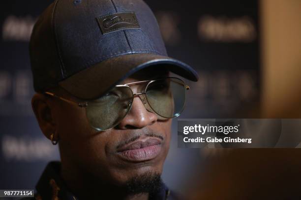 Singer/songwriter Ne-Yo speaks with an interviewer during the release party for his seventh studio album "Good Man" at Apex Social Club at Palms...