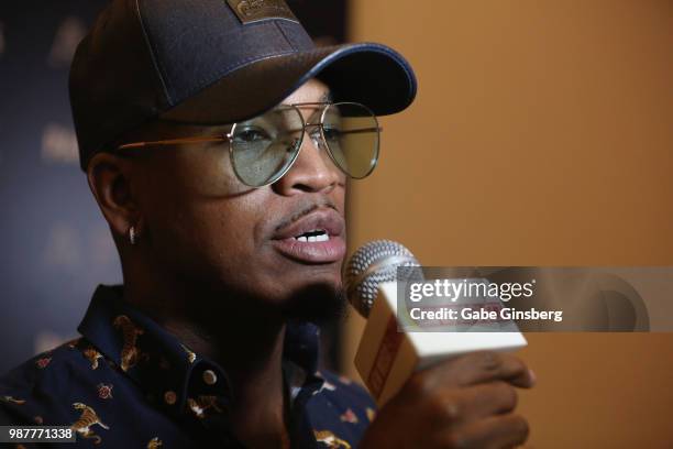 Singer/songwriter Ne-Yo speaks with an interviewer during the release party for his seventh studio album "Good Man" at Apex Social Club at Palms...