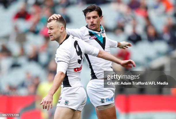 Robbie Gray of the Power celebrates a goal with Riley Bonner of the Power during the 2018 AFL round 15 match between the Carlton Blues and the Port...
