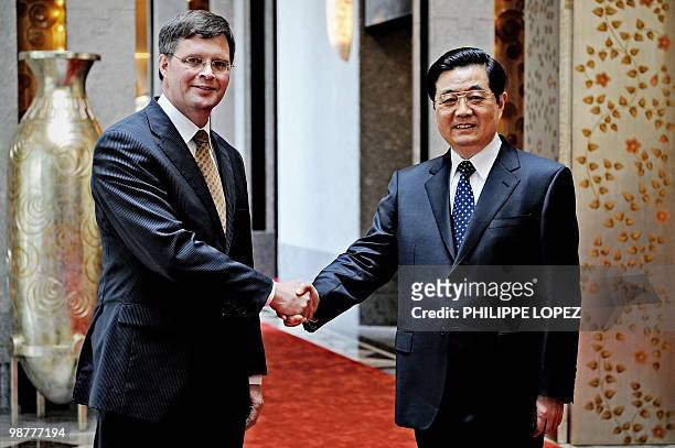 Dutch Prime Minister Jan Peter Balkenende shakes hands with Chinese President Hu Jintao prior to a meeting in Shanghai on May 1, 2010. Balkenende is...